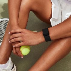 Fitness band worn on a tennis court